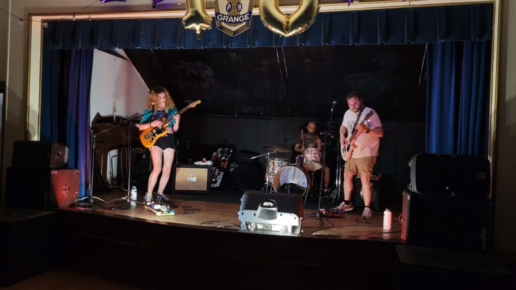 No Momentum performing at the Balmville Grange with Kelly Bowman on lead guitar and vocals, Curt Giventar on bass, and Marty Headley on drums. 